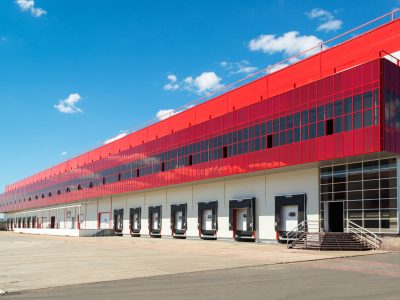 Modern warehouse on a background of blue sky
